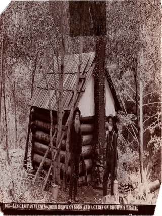 Two Photographs of John Brown’s Sons Owen and Jason Outside Their Cabins in the San Gabriel Mountains.