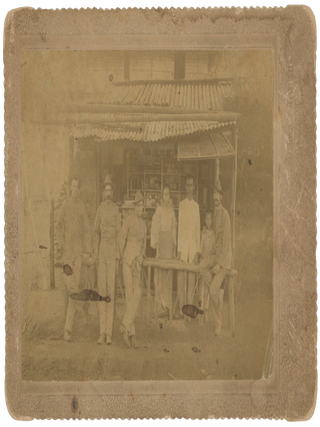Item #List2992 Photograph of Four American Soldiers Posing with a Filipino Family in Tanauan...