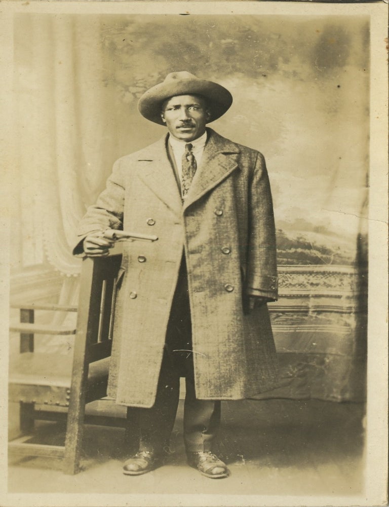 Item #List3830 Real Photo Postcard of African American Rodeo Cowboy and Performer Bill Pickett, Holding a Pistol. African-Americana &ndash; Western Americana &ndash; Texas, Bill Pickett.
