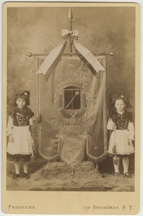 Item #List3863 Cabinet Card Photograph of Two Girls in Alsatian Dress with the Banner of the...